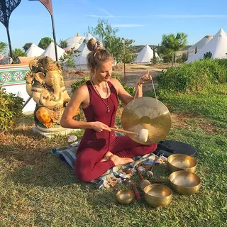 Lidiya playing a gong