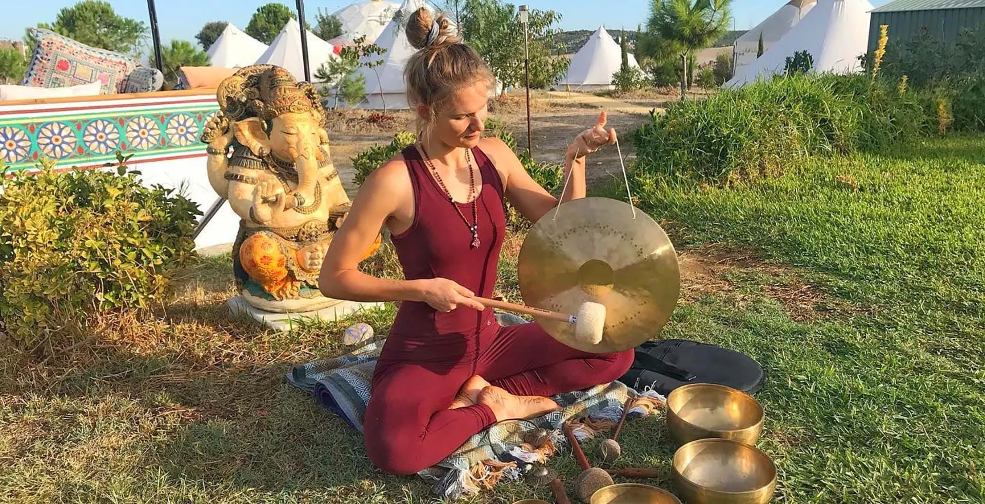 Lidiya playing a gong