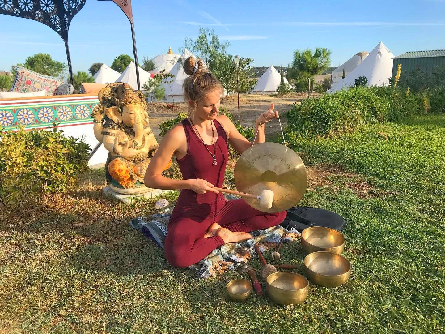 Lidiya playing a gong