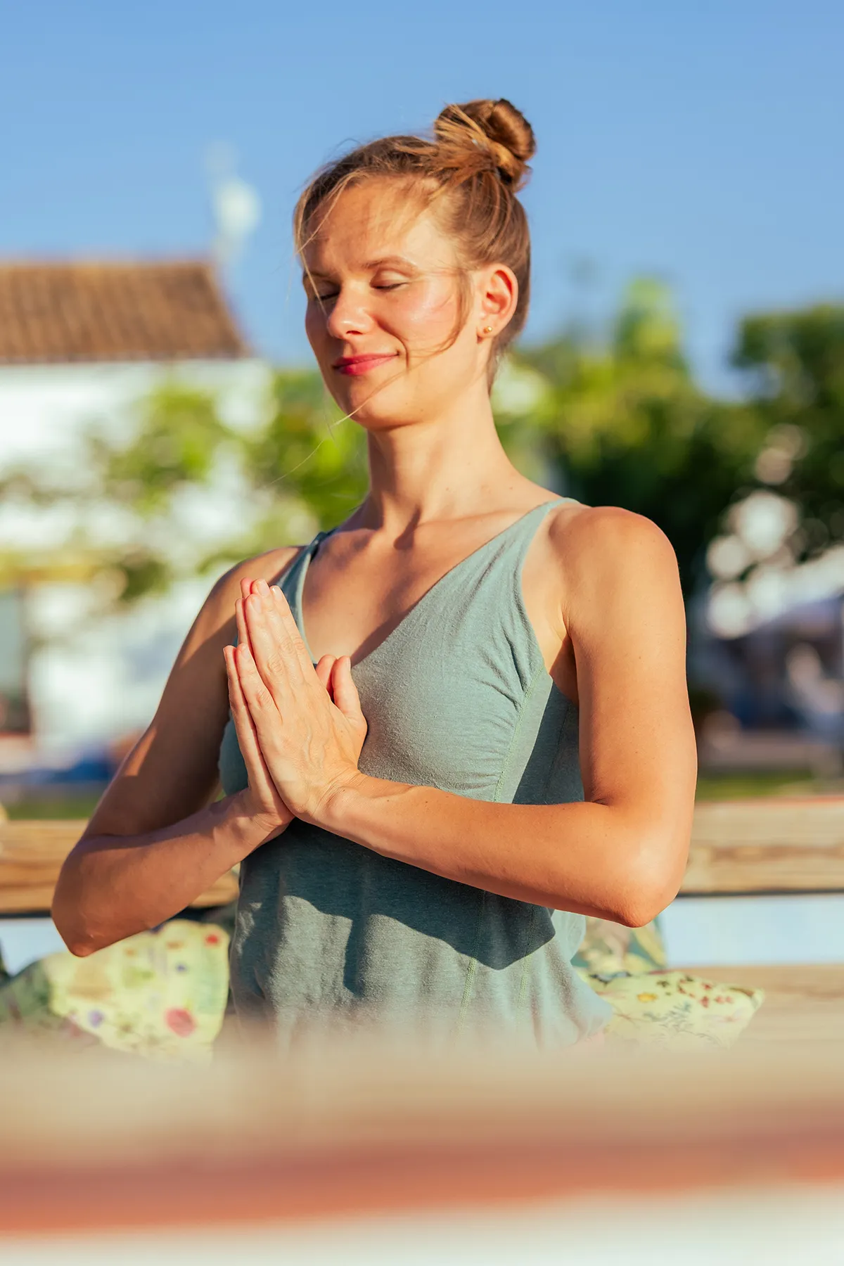 Lidiya with eyes closed, hands in prayer