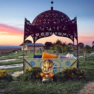 A pagoda at Suryalila with a statue of Ganesha